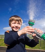 Pictured being smarter with his water is Eoin Dawson (5) using a trigger nozzle on the garden hose | NI Water News